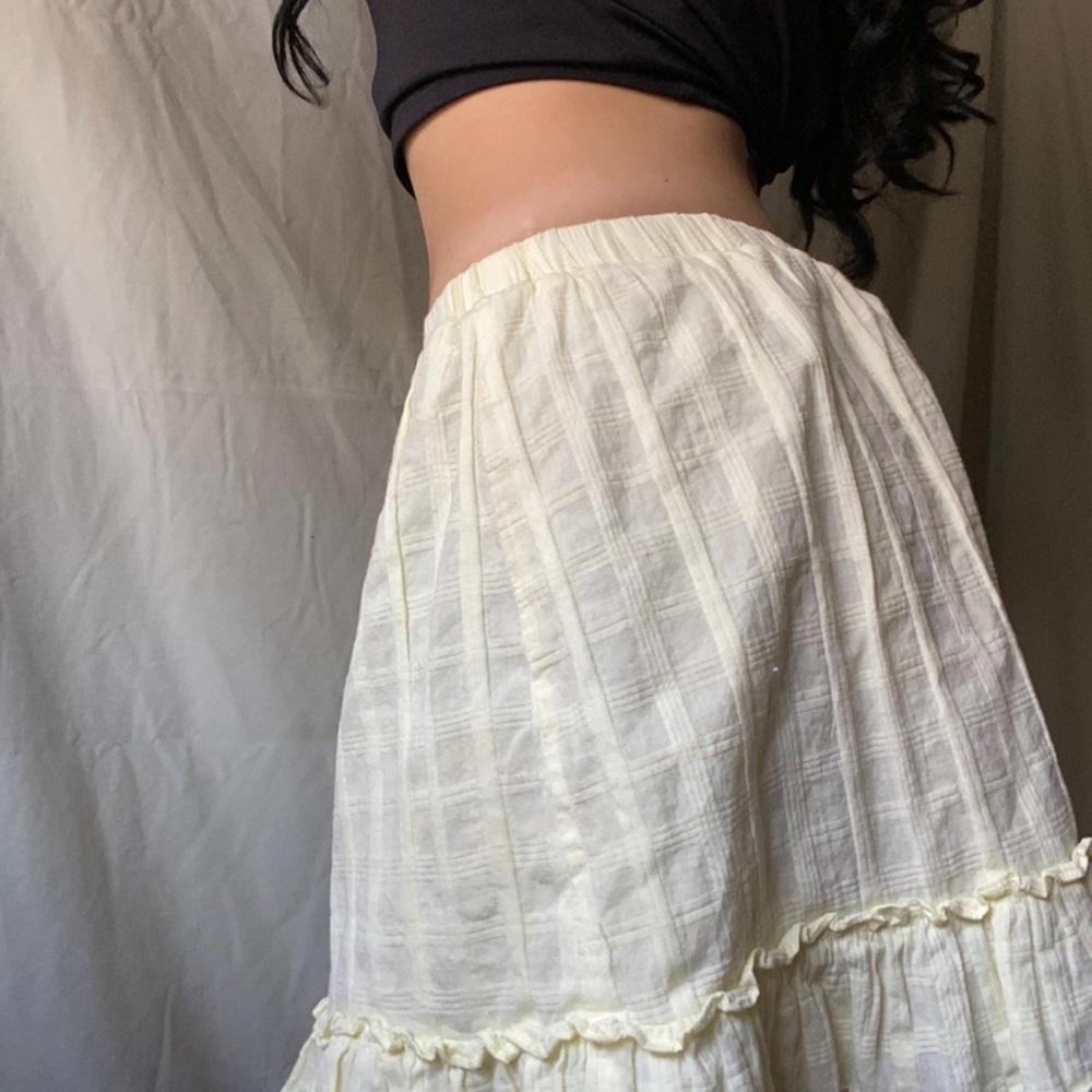 A midi, milkmaid, sweet & girly light yellowy/cream skirt with ruffle detailing.
